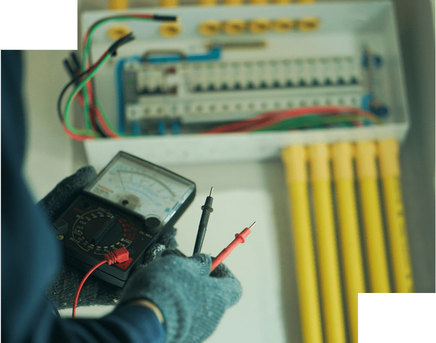 Person testing electrical panel with multimeter.