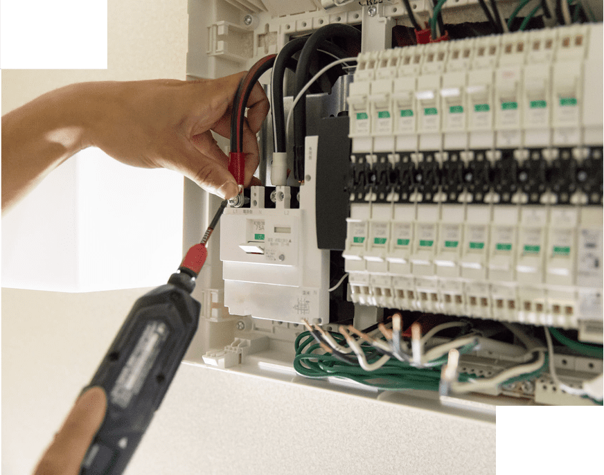 Electrician working on a circuit breaker panel.