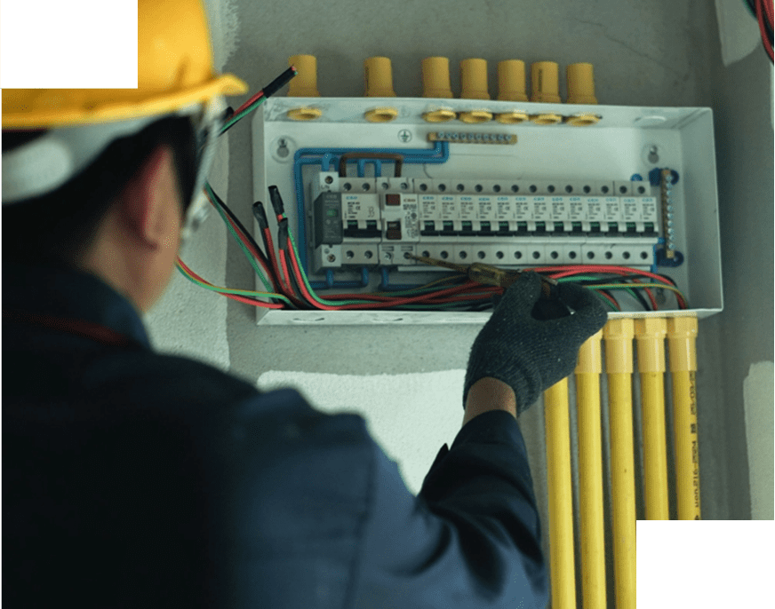 Electrician working on a circuit breaker panel.